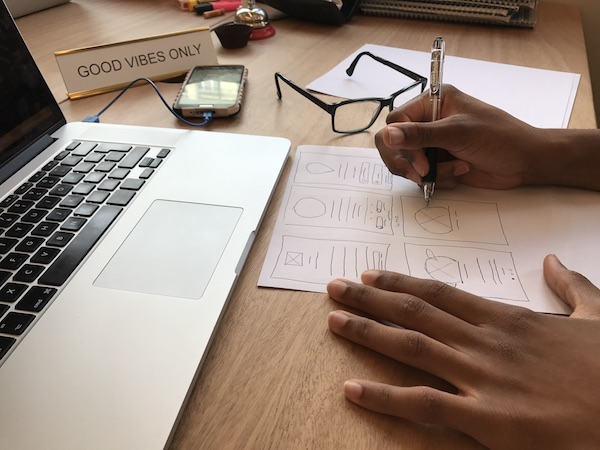 This photo has a tight crop and is much more effective at telling the story of what he's working on – wireframes for an app! He also had no idea this photo was being taken. (FYI, there are a few versions of this shot that were taken with slightly differ