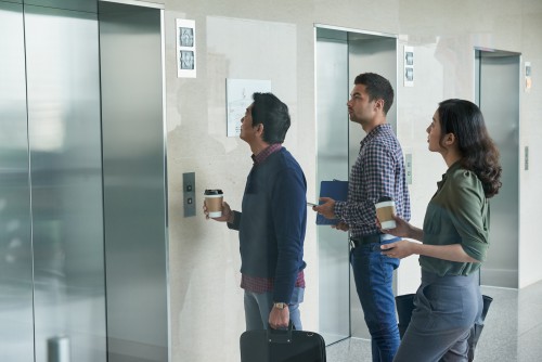 The familiar morning wait for the elevator