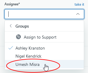 The open assignee dropdown menu is shown. From top to bottom the list shows: Groups, assign to support; Ashley Kranston; Nigel Kendrick; Umesh Misra - indicated by the cursor and circled.